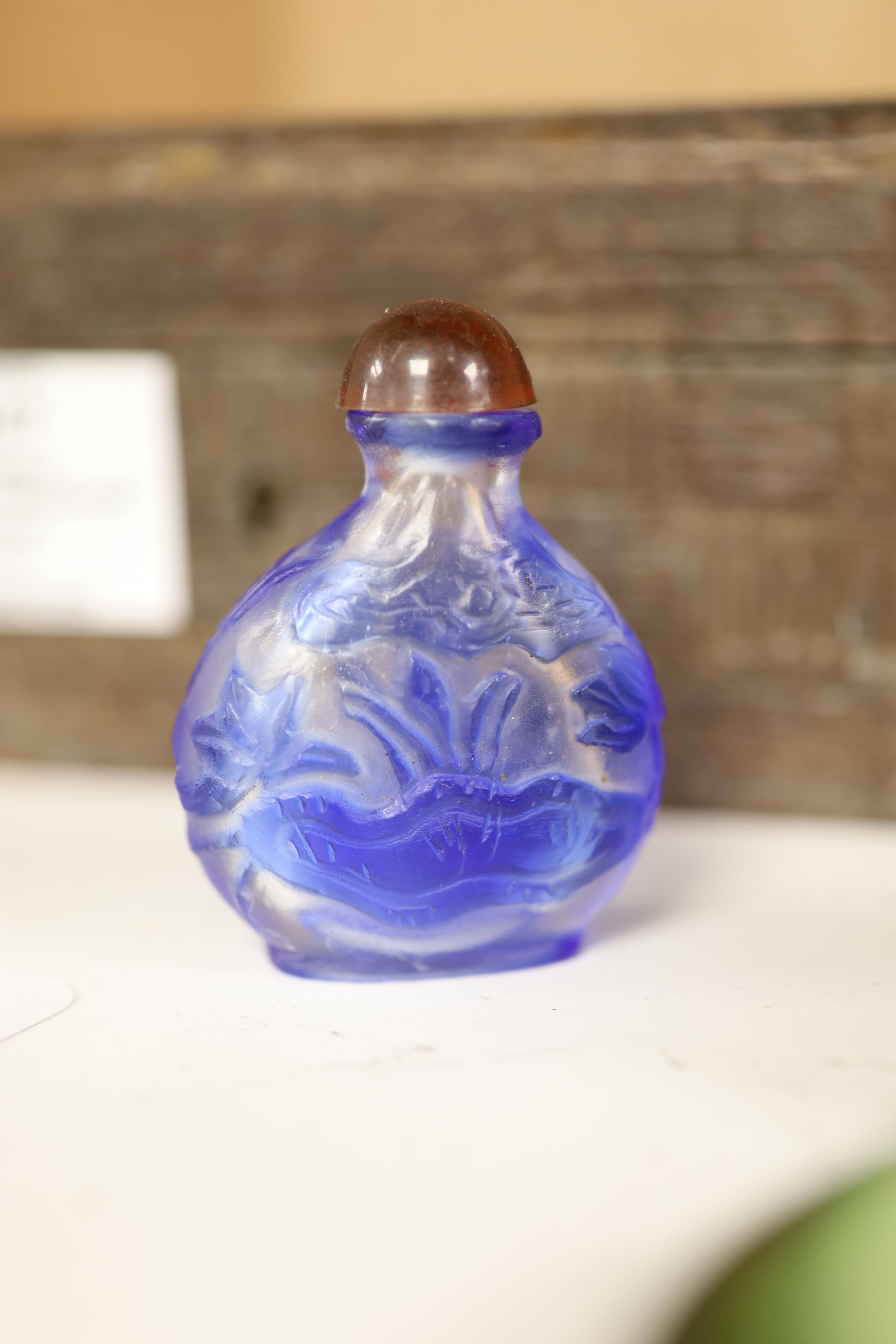 A small miscellaneous Oriental collection including enamel snuff boxes, Buddha carvings etc.